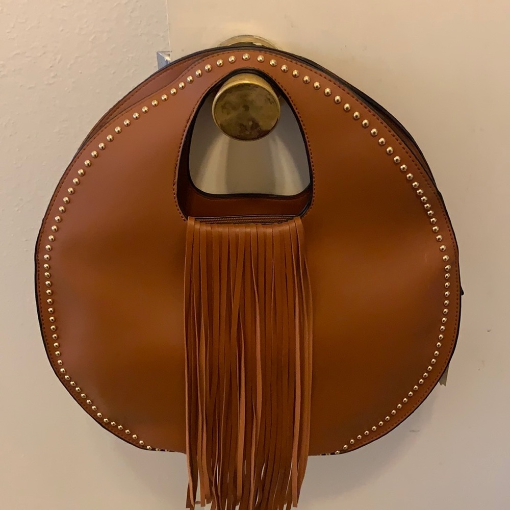 Very cute ladies handbag brown with tassels.